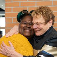 Lynn Blue hugging a guest at the Lynn M. Blue Connection Naming Ceremony